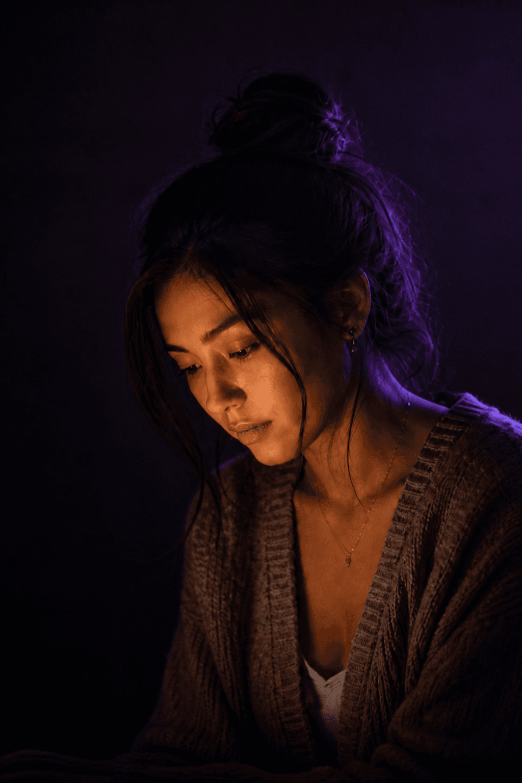 A close portrait of a woman listening